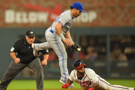 Jul 11, 2018; Atlanta, GA, USA; Toronto Blue Jays second baseman Devon Travis (29) tries to get a tag on Atlanta Braves center fielder Danny Santana (23) eighth inning at SunTrust Park. Mandatory Credit: Dale Zanine-USA TODAY Sports