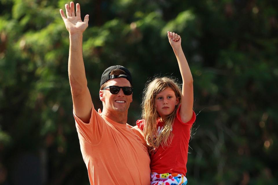 Tom Brady #12 of the Tampa Bay Buccaneers celebrates with his daughter Vivian during the Tampa Bay Buccaneers Super Bowl boat parade