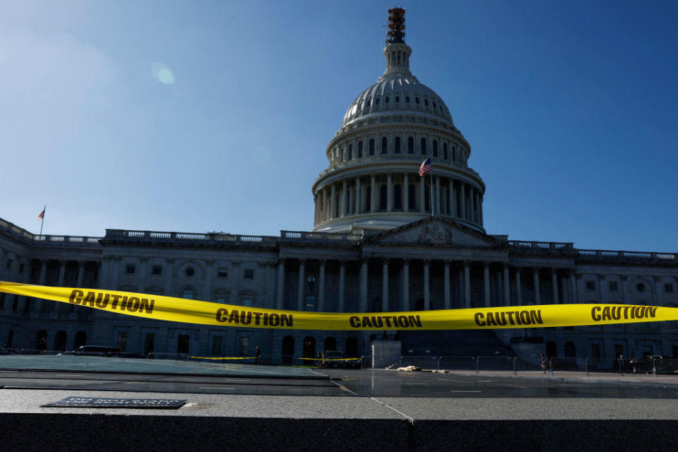 Caution tape blows in the wind on the east front plaza of the U.S. Capitol Building on Sept. 27, 2023, in Washington, D.C.  / Credit: Anna Moneymaker/Getty Images