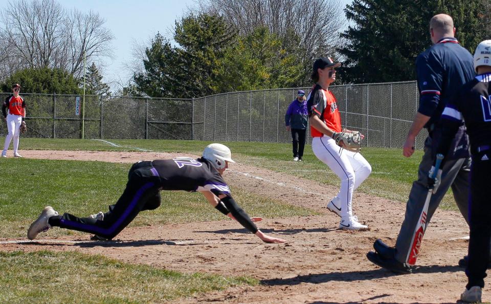 Kiel’s Grant Manz (12) arrives at home plate against Cedar Grove-Belgium, Saturday, April 6, 2024, in Cedar Grove, Wis.