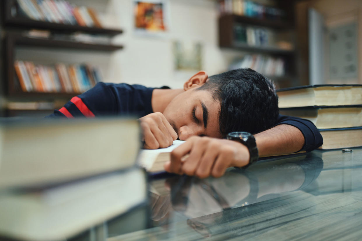 Teenage boy in the library Getty Images/Mayur Kakade