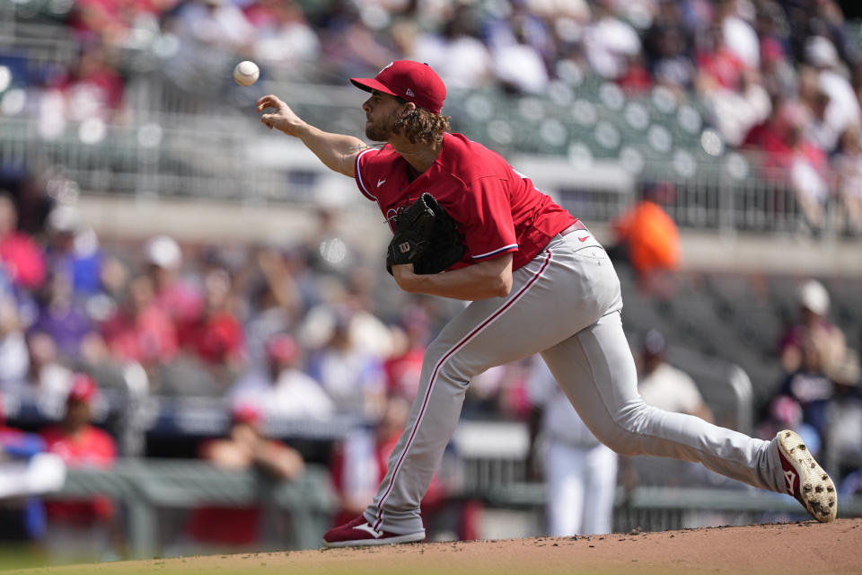 Philadelphia Phillies starting pitcher Aaron Nola (27) delivers in the first inning of a baseball game against the Atlanta Braves, Wednesday, Sept. 20, 2023, in Atlanta. (AP Photo/Brynn Anderson)