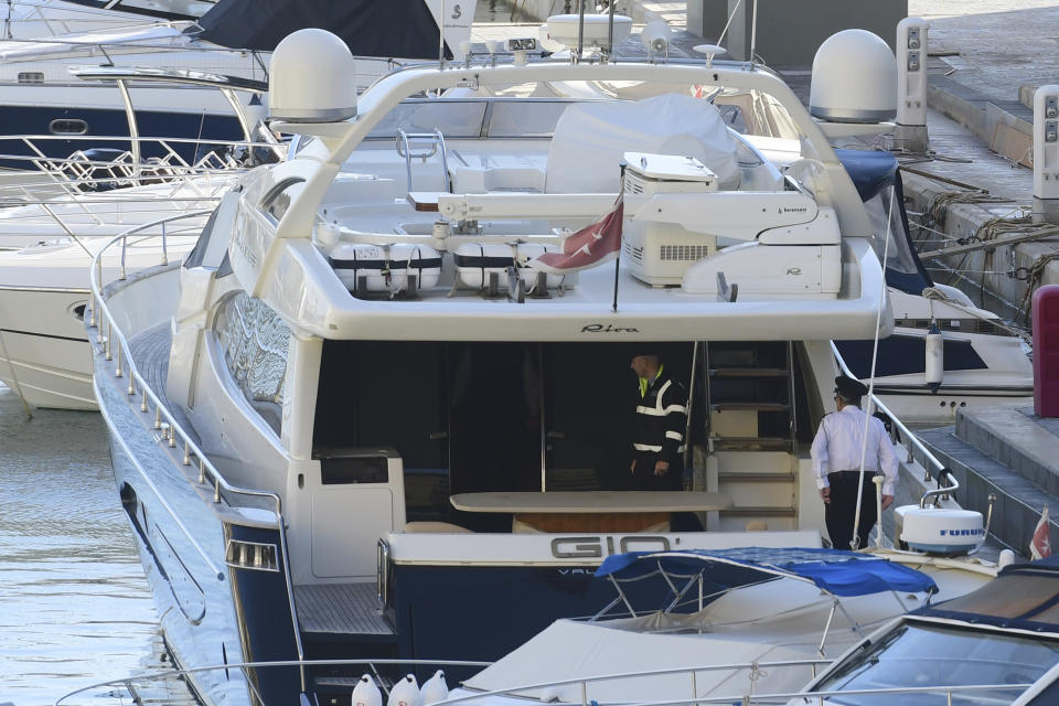 Police aboard the yacht "Gio" after it was intercepted on a course for Sicily by the Maltese military early Wednesday, Nov. 20, 2019, and forced back to Portomaso, Malta. Malta authorities on Wednesday arrested the boat owner, prominent Maltese businessman Yorgen Fenech, who appears to be a “person of interest” in the assassination of leading investigative reporter Daphne Caruana Galizia. (AP Photo/Jonathan Borg)