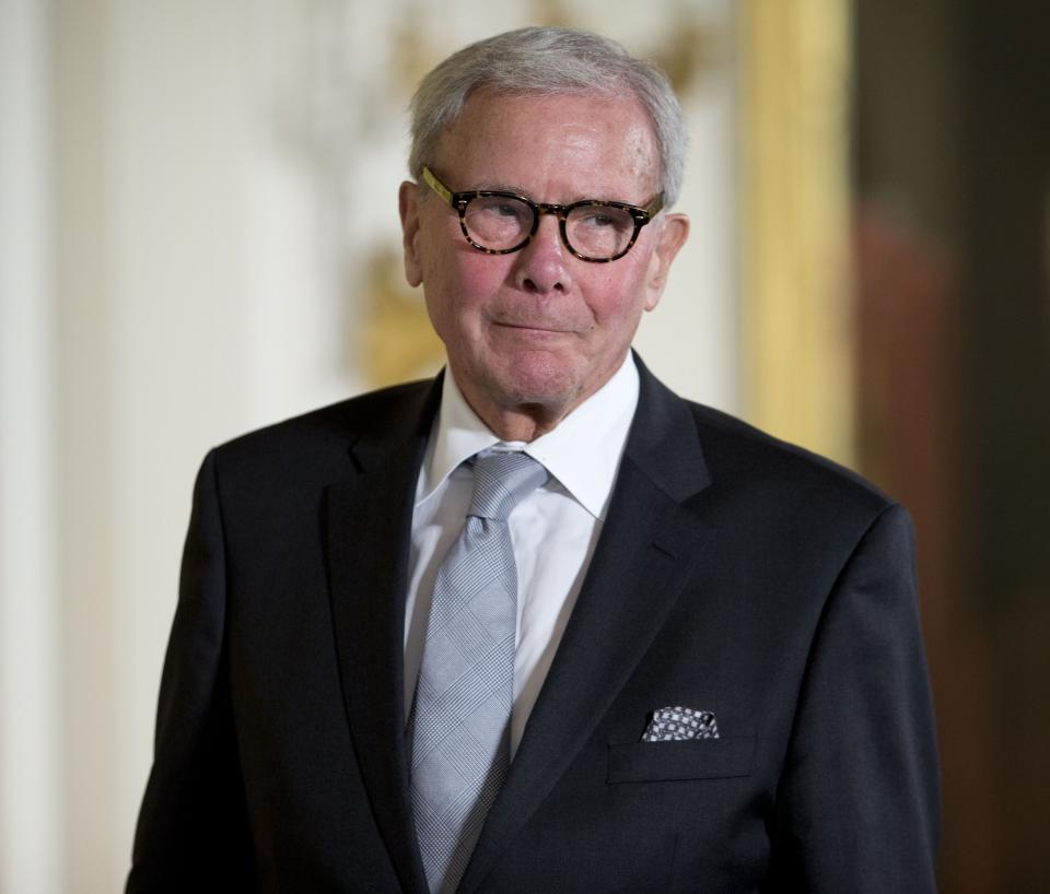 Tom Brokaw is pictured as receives the Presidential