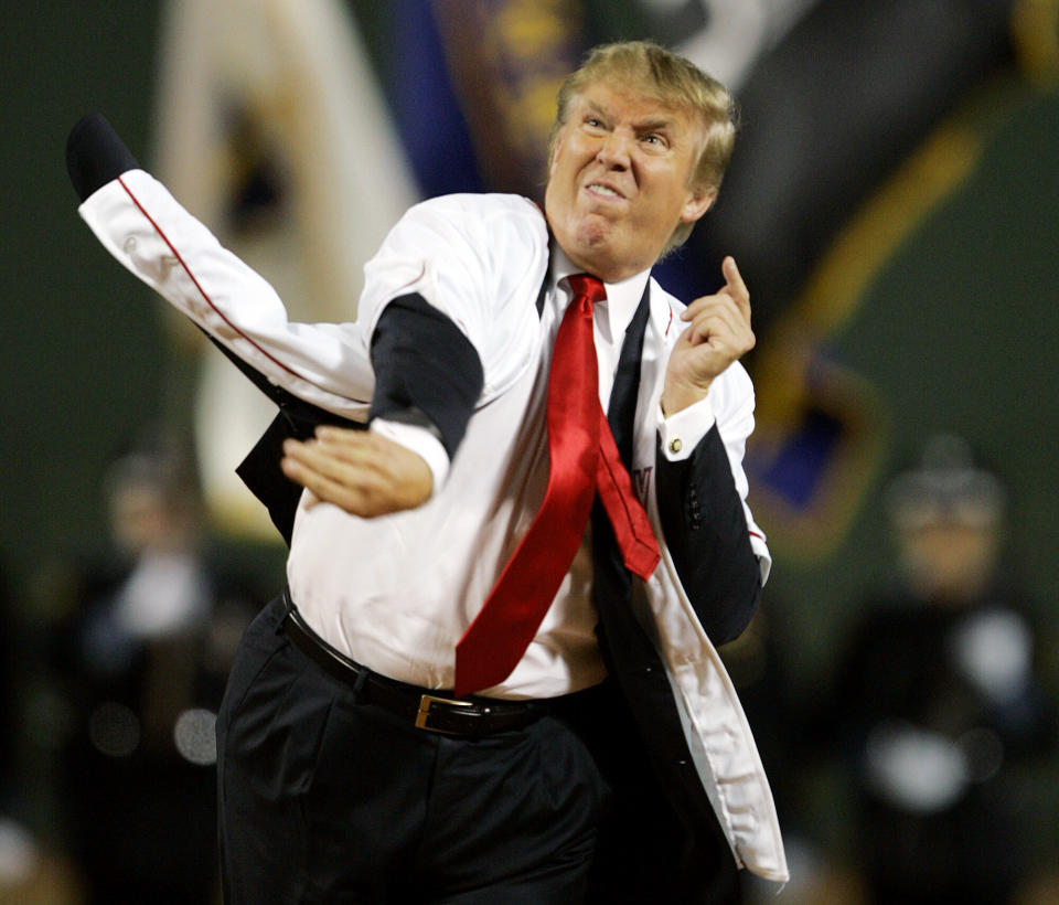 Donald Trump throws out the ceremonial first pitch before the start of the game between the Boston Red Sox and the New York Yankees in the second game of a day/night doubleheader on Aug. 18, 2006, at Fenway Park in Boston.&nbsp; (Photo: AP Photo/Charles Krupa)