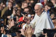 Pope Francis waves from the popemobile before his inauguration mass at St Peter's Square on March 19, 2013 at the Vatican. Nearly 200,000 pilgrims attended the historic event with the pope vowing to embrace the "poorest, the weakest" of humanity