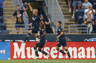 Philadelphia Union defender Jakob Glesnes, left, reacts to his goal during the first half of an MLS soccer match against the Toronto FC, Wednesday, Aug. 4, 2021, in Chester, Pa. (AP Photo/Christopher Szagola)