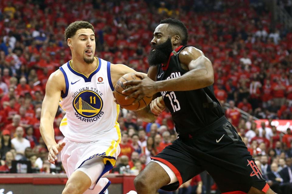 Rockets guard James Harden (13) drives against Warriors guard Klay Thompson (11) during Game 7 of the Western conference finals of the 2018 NBA Playoffs at Toyota Center.