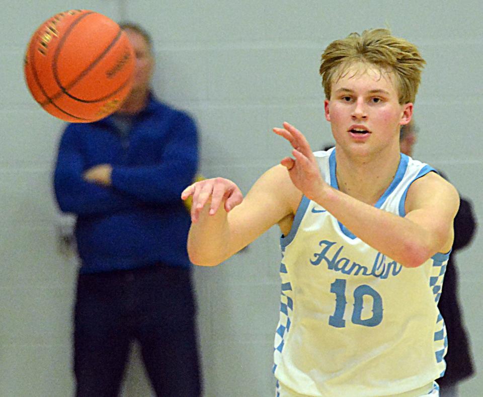 Hamlin's Evan Stormo dishes the ball during a high school boys basketball game on Monday, Feb. 5, 2024 at the Hamlin Education Center. No. 2 Hamlin topped No. 4 Sioux Valley 80-48 in a battle of rated Class A teams.