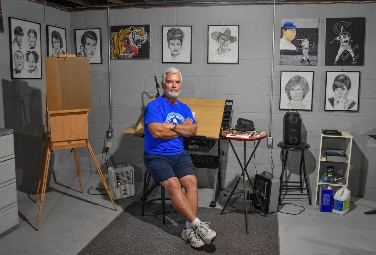 Carlos Ollervides sits surrounded by his work in his basement art studio in his Clyde home. He has never been trained in art.