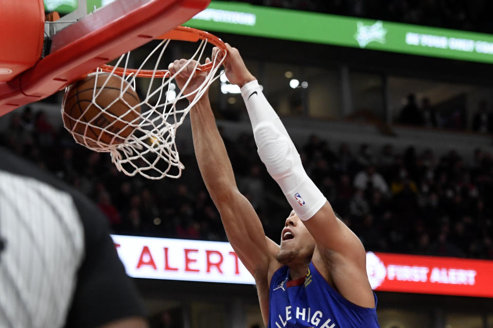 Denver Nuggets forward Aaron Gordon dunks against the Chicago Bulls during the first half of an NBA basketball game Monday, Dec. 6, 2021, in Chicago. (AP Photo/Matt Marton)