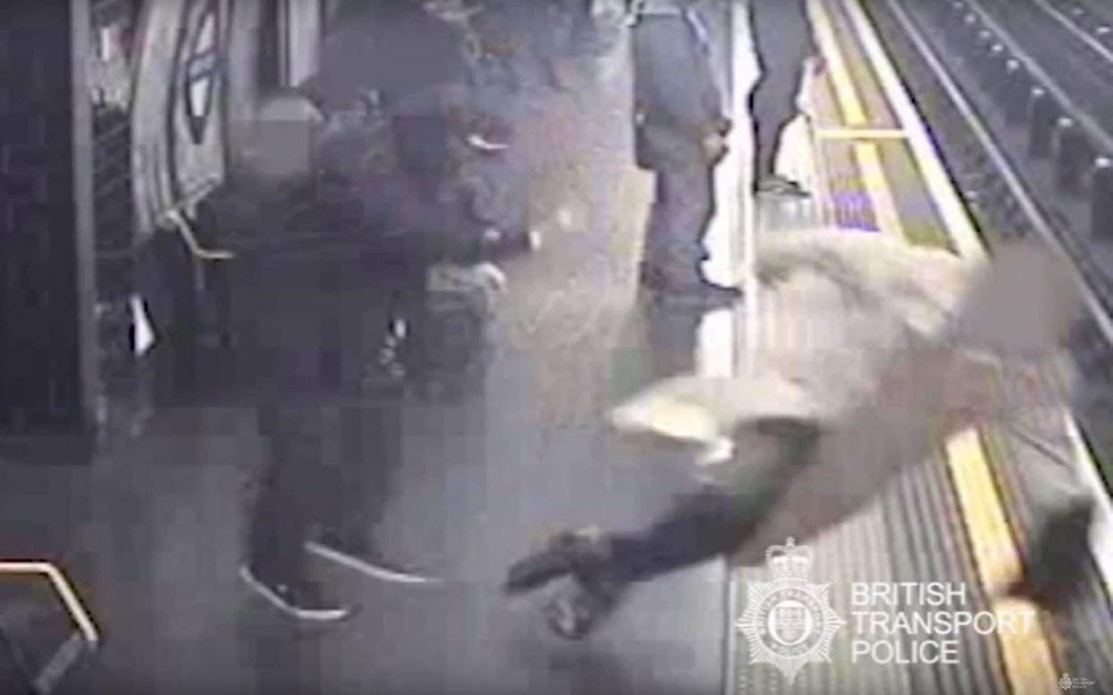 CCTV issued by British Transport Police of Sir Robert Malpas being pushed on to the tracks by Paul Crossley - PA