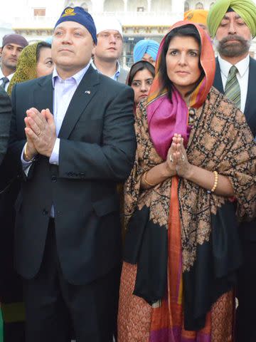 <p>Sameer Sehgal/Hindustan Times/Getty</p> Nikki Haley along with her husband Michael Haley paying obeisance at Golden Temple in 2014