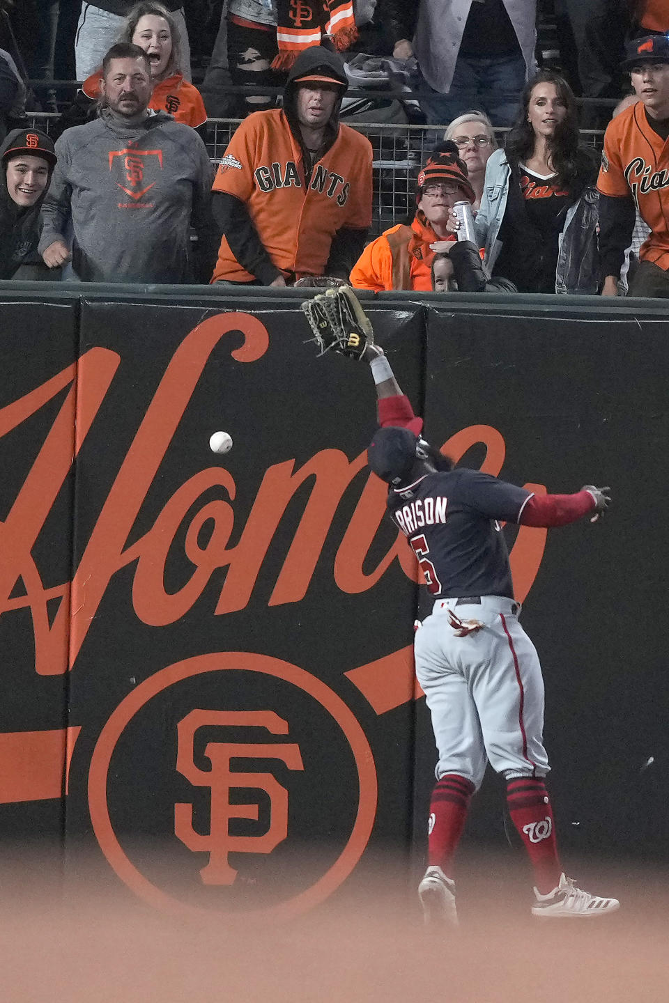 Washington Nationals left fielder Josh Harrison (5) cannot make the catch on a double by San Francisco Giants' Curt Casali during the sixth inning of a baseball game Friday, July 9, 2021, in San Francisco. (AP Photo/Tony Avelar)
