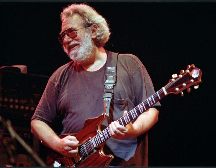 FILE--This Nov. 1, 1992 file photo shows Grateful Dead lead singer Jerry Garcia performing in Oakland , Calif. Garcia, who died on Aug. 9, 1995, Cyndi Lauper and Toby Keith will be inducted into the Songwriters Hall of Fame in June. The organization announced Wednesday that Linda Perry, country music songwriter Bobby Braddock and “Hoochie Coochie Man” writer Willie Dixon will also be inducted on June 18. (AP Photo/Kristy McDonald, File)