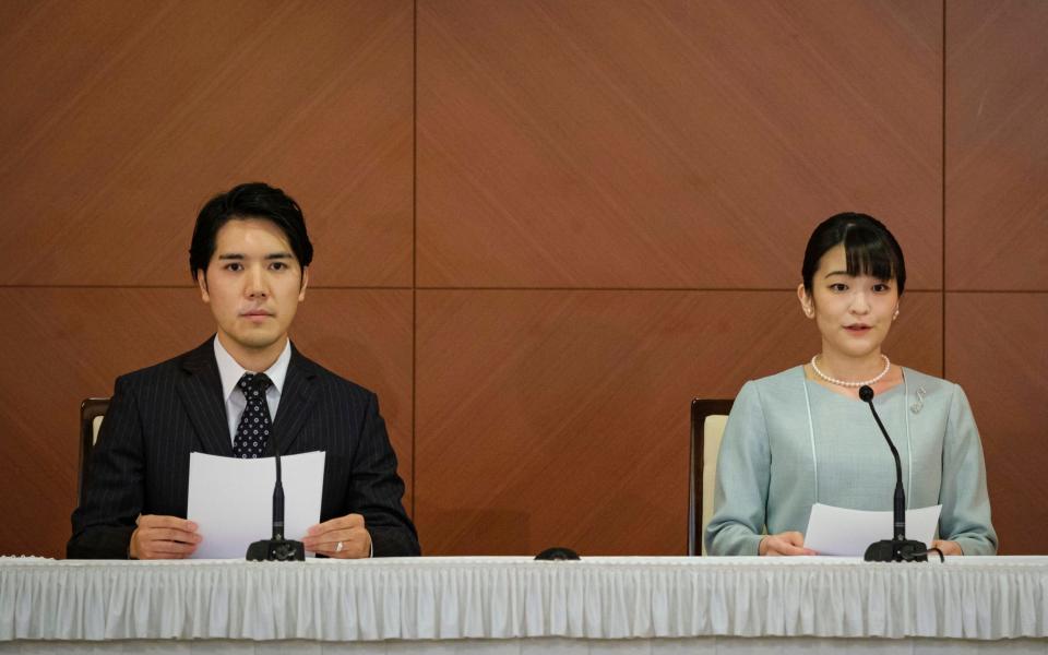 Japan's former Princess Mako, right, the elder daughter of Crown Prince Akishino and Crown Princess Kiko, and her husband Kei Komuro, attend a press conference to announce their marriage, at a hotel in Tokyo