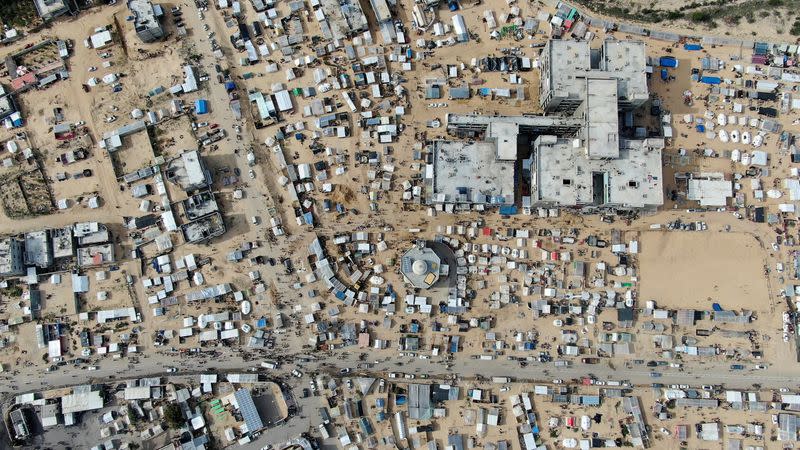 FILE PHOTO: Displaced Palestinians, who fled their houses due to Israeli strikes amid the ongoing conflict between Israel and the Palestinian Islamist group Hamas, take shelter tent camps, in Rafah