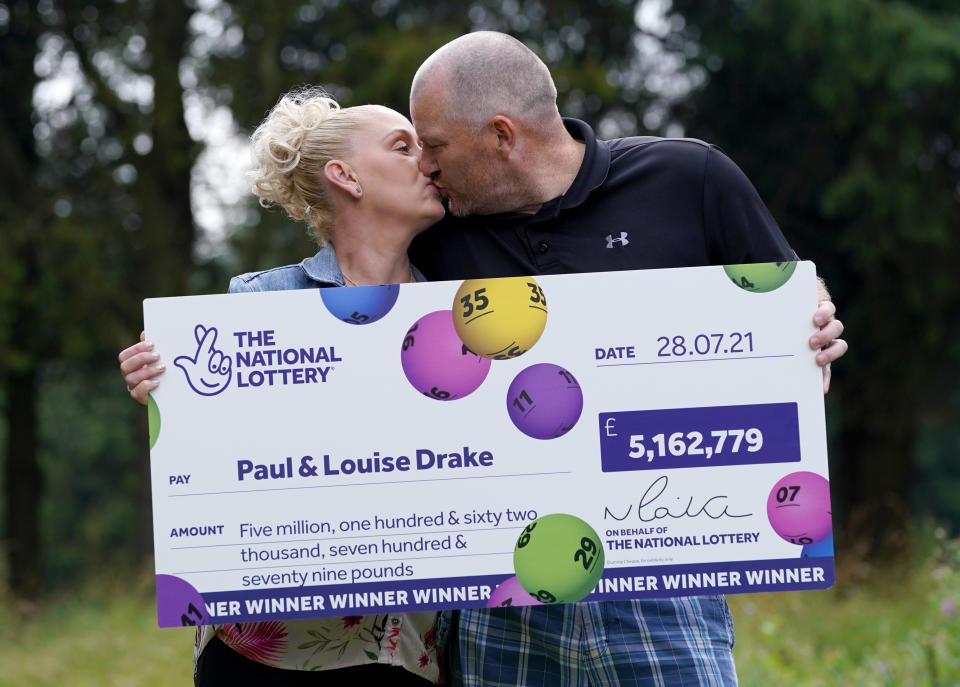 <p>Paul and Louise Drake celebrating their �5.16 million pound lottery win at Deer Park Golf and Country Club in Livingston, West Lothian. Paul and Louise, a district nurse, live with their two sons, aged 11 and 15, in Seafield near Bathgate, Edinburgh. Picture date: Friday August 6, 2021.</p>
