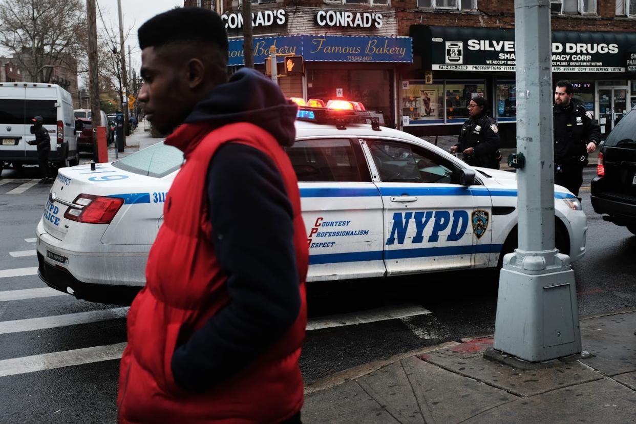 New York City's use of stop-and-frisk was found to be unconstitutional in 2013. <a href="https://www.gettyimages.com/detail/news-photo/people-walk-past-a-police-car-in-the-in-the-brownsville-news-photo/1188492384" rel="nofollow noopener" target="_blank" data-ylk="slk:Spencer Platt/Getty Images;elm:context_link;itc:0;sec:content-canvas" class="link ">Spencer Platt/Getty Images</a>