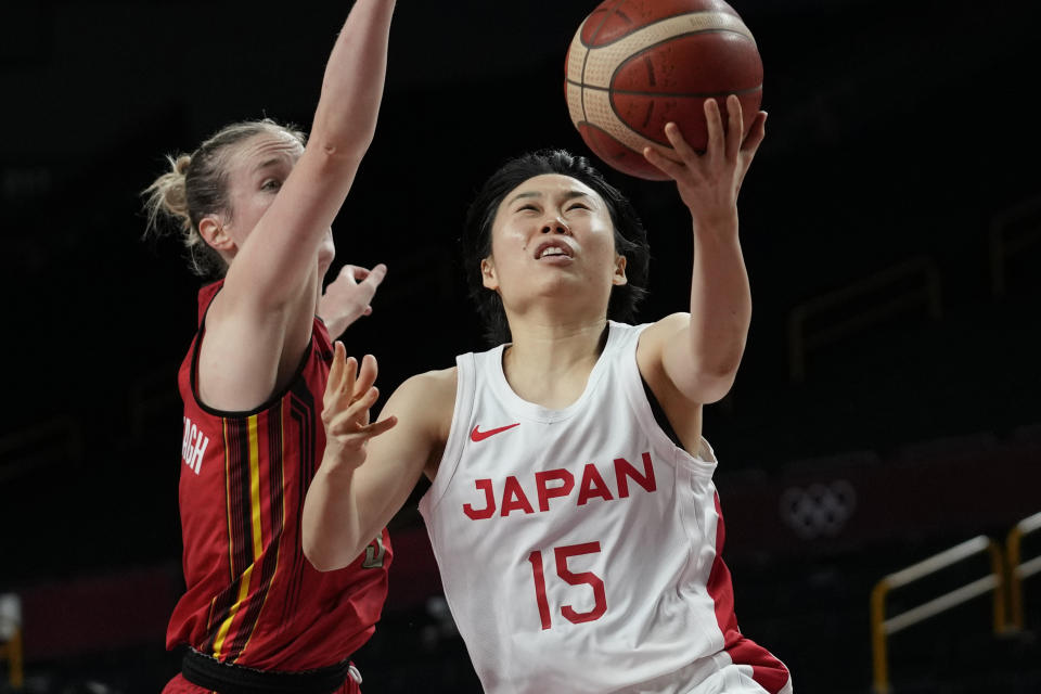 Japan's Nako Motohashi (15) drives to the basket against Belgium's Kim Mestdagh (5) during a women's basketball quarterfinal game at the 2020 Summer Olympics, Wednesday, Aug. 4, 2021, in Saitama, Japan. (AP Photo/Eric Gay)