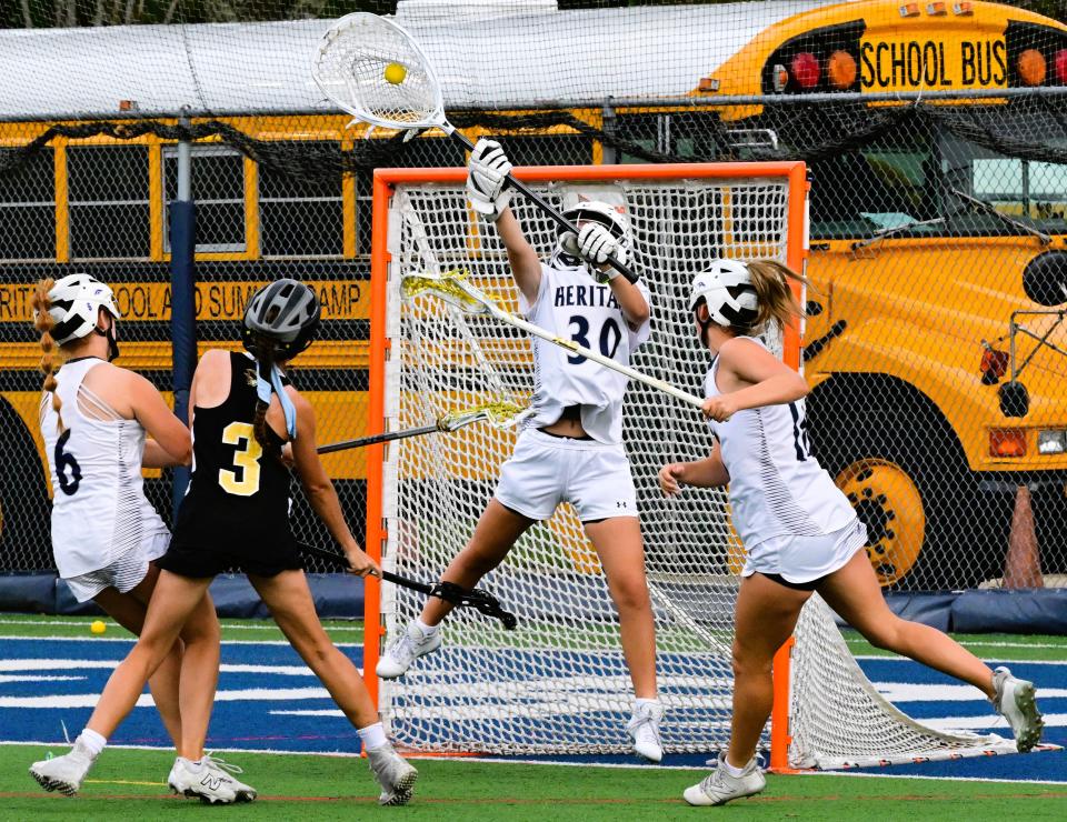 American Heritage-Delray goaltender Ashley Egbert makes an athletic save during the Stallions' regional semifinals win on April 30, 2024.