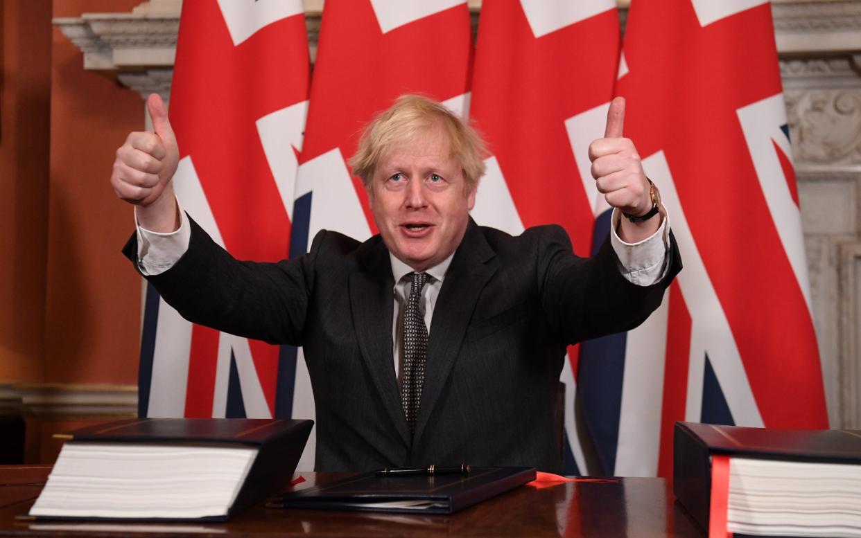 Prime Minister, Boris Johnson gives a thumbs up gesture after signing the Brexit trade deal with the EU in number 10 Downing Street on December 30 - Leon Neal/Getty Images