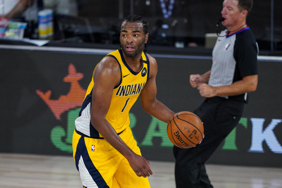 Indiana Pacers forward T.J. Warren (1) plays against the Orlando Magic during the second half of an NBA basketball game Tuesday, Aug. 4, 2020 in Lake Buena Vista, Fla. (AP Photo/Ashley Landis)