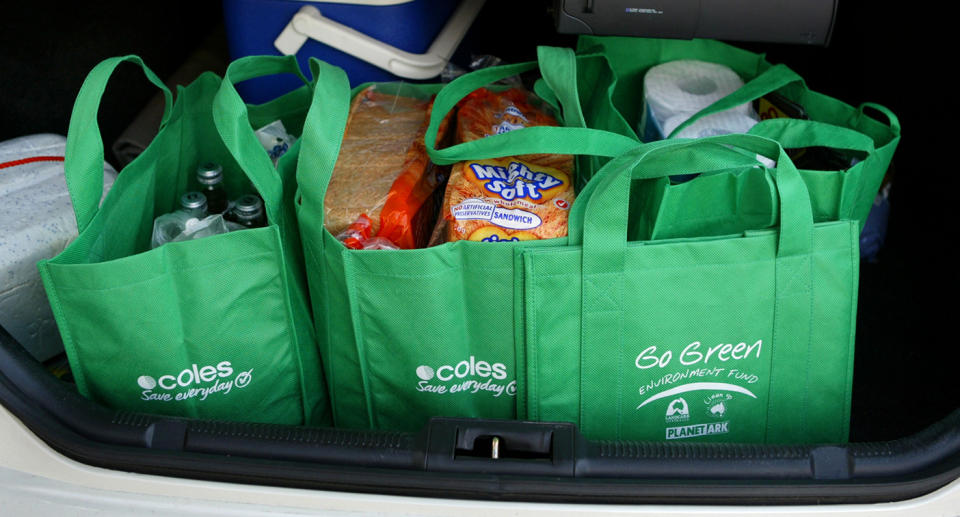 Placing groceries too far back in the car boot can strain the body when lifting them out later, so keep them close. Source: Getty