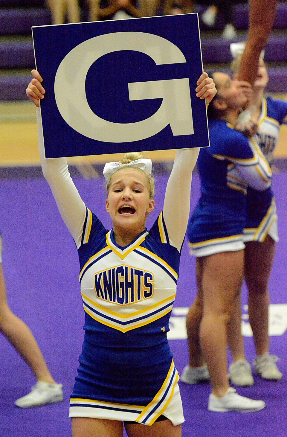 A Sioux Falls O'Gorman cheerleader holds up a sign during the Class AA portion of the South Dakota State Competitive Cheer and Dance Championships on Saturday, Oct. 22, 2022 in the Watertown Civic Arena. O'Gorman finished second in cheer.