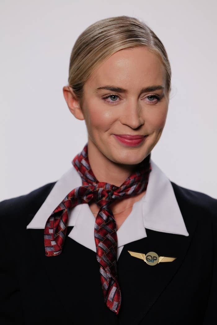 Emily Blunt wearing a scarf around her neck