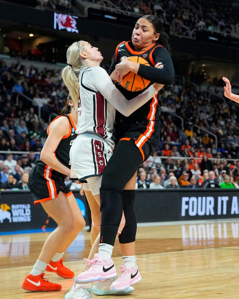 South Carolina Gamecocks forward Chloe Kitts (21) and Oregon State Beavers forward Timea Gardiner (30) battle for the ball during the second half in the finals of the Albany Regional of the 2024 NCAA Tournament at MVP Arena March 31, 2024, in Albany, New York.