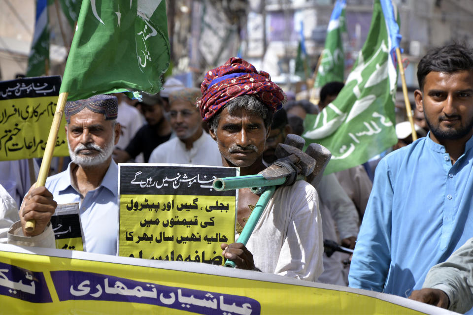 Supporters of Jamaat-e-Islami chant anti-Pakistan government during a strike against inflation in Hyderabad, Pakistan, Saturday, Sept. 2, 2023. Pakistani traders on Saturday went on strike against the soaring cost of living, including higher fuel and utility bills and record depreciation of the rupee against the dollar, which has led to widespread discontent among the public. (AP Photo/Pervez Masih)