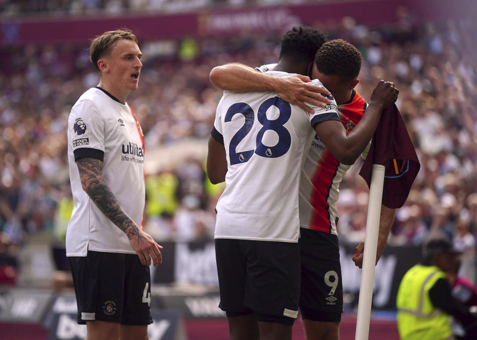 Luton Town's Albert Sambi Lokonga celebrates scoring their side's first goal of the game during the English Premier League soccer between West Ham United and Luton Town match at the London Stadium, London, Saturday May 11, 2024. (Victoria Jones/PA via AP)
