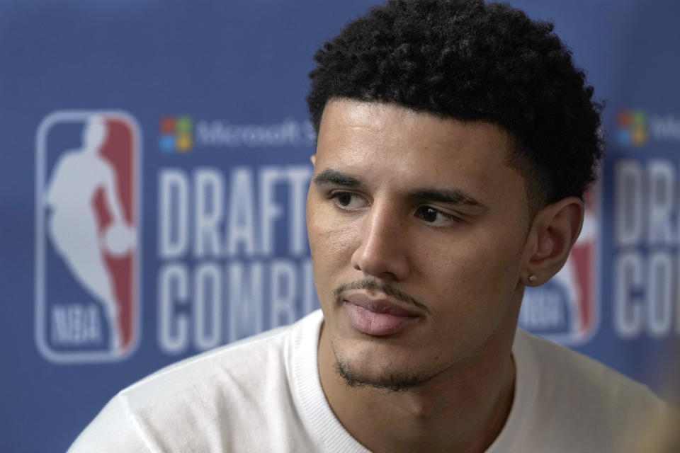 Johnny Davis, from Wisconsin, talks with reporters during the NBA basketball draft combine at the Wintrust Arena, Thursday, May 19, 2022, in Chicago. (AP Photo/Charles Rex Arbogast)