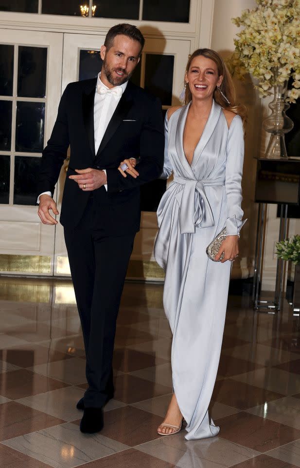 Ryan Reynolds in Burberry, with Blake Lively in Ralph & Russo