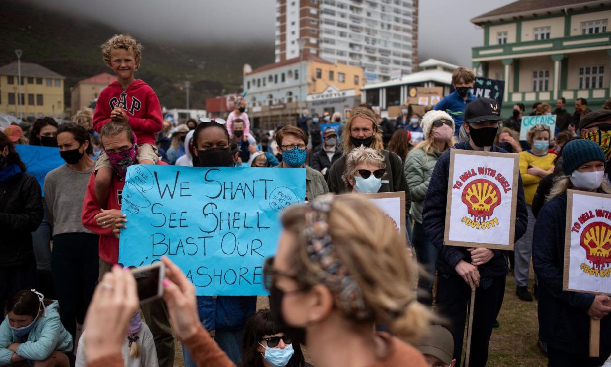 <span>People take part in a protest against the plan by Dutch oil company Shell to conduct underwater seismic surveys along South Africa in 2021.</span><span>Photograph: Rodger Bosch/AFP/Getty Images</span>