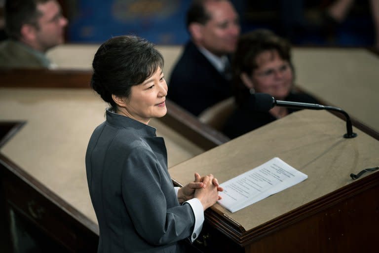 President of South Korea Park Geun-hye addresses a joint meeting of Congress in Washington, DC, on May 8, 2013. Park fired her spokesman over an unspecified "unsavoury" act midway through a summit trip to the US