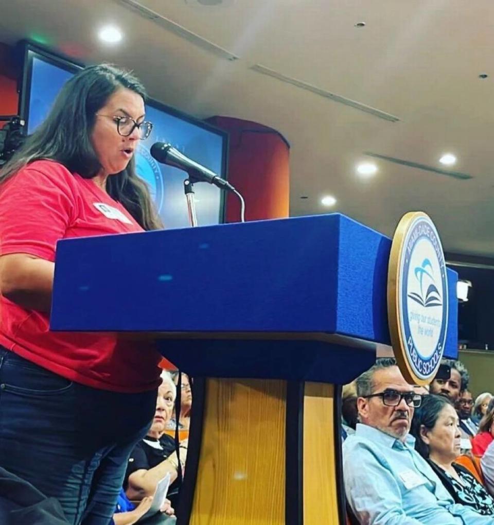 Lissette Fernandez, co-founder of Moms for Libros, speaks at a Miami-Dade County School Board meeting. She co-founded the organization after reading a story in the Miami Herald about a parent who wanted Amanda Gorman’s poem, ‘The Hill We Climb,’ delivered at the inauguration of President Biden in 2021, removed from the library shelves at Bob Graham Education Center, a K-8 public school in Miami Lakes.