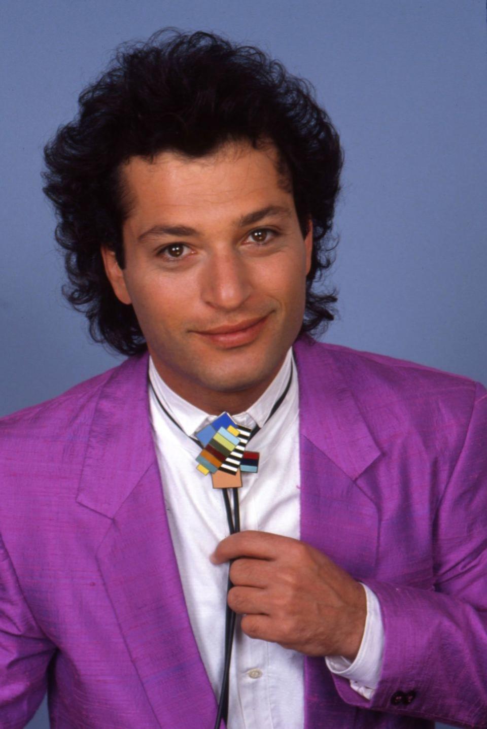 <p>It was the '80s, man. Not many had yet embraced the bald life, and the mullet was still trending—as proven by the comedian's style of choice.</p>