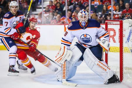 Nov 17, 2018; Calgary, Alberta, CAN; Edmonton Oilers goaltender Mikko Koskinen (19) watches the puck against the Calgary Flames during the third period at Scotiabank Saddledome. Mandatory Credit: Sergei Belski-USA TODAY Sports