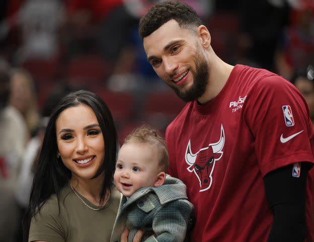 <p>Quinn Harris/Getty</p> Zach LaVine with his wife, Hunter LaVine, and their son, Saint, pose for a photo after the game against the Detroit Pistons at United Center on April 09, 2023.