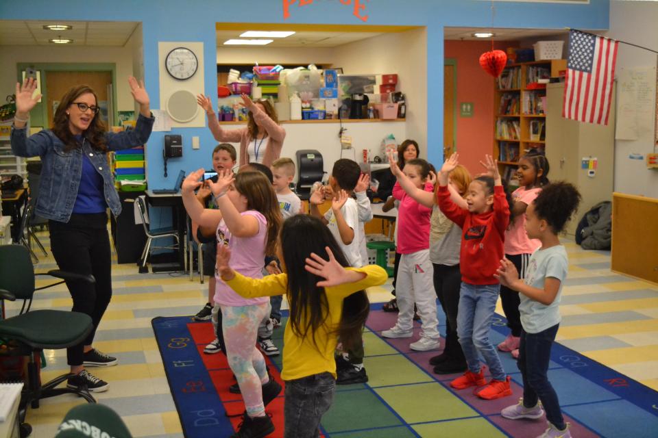 Catherine Piazza leads the students through a dance.