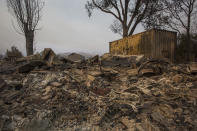 <p>Structures at Rancho Alegre Boy Scouts of America outdoor school are left in ruins after the Whittier Fire swept through on July 9, 2017 near Santa Barbara, California. (David McNew/Getty Images) </p>