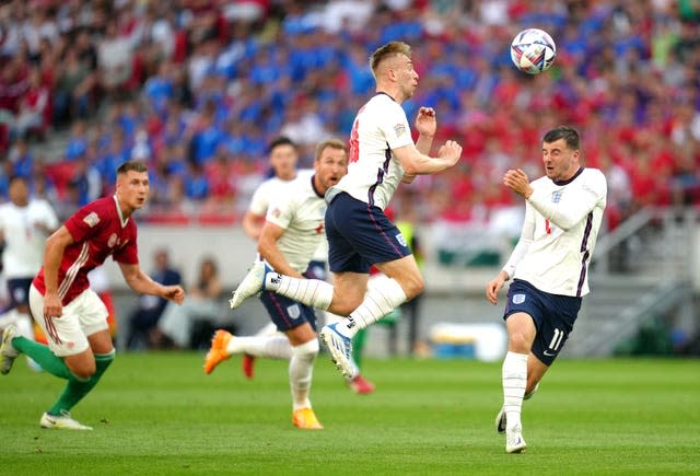 Jarrod Bowen (centre) heads the ball