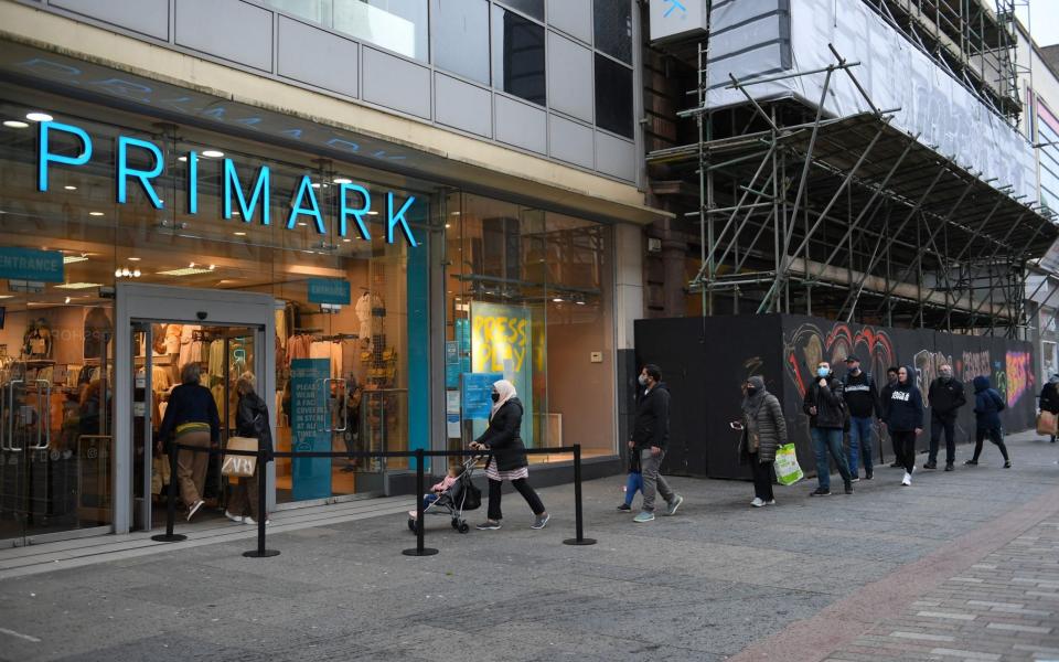 Shoppers queueing at Primark in Glasgow - Andy Buchanan/AFP