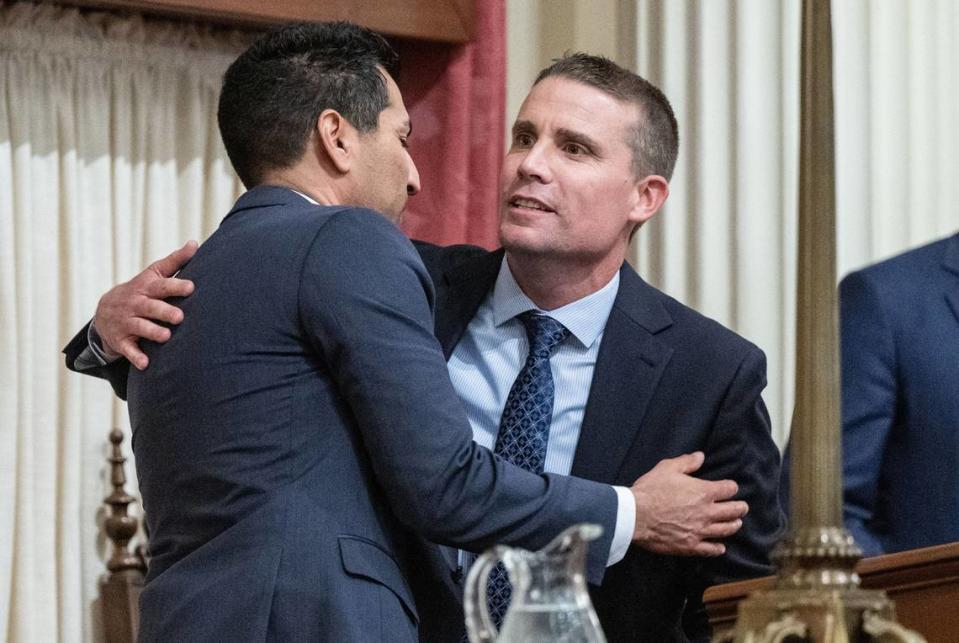 Newly sworn in California Senate president pro tempore Mike McGuire, D-Healdsburg, right, is congratulated by Assembly Speaker Robert Rivas, D-Hollister, on Monday, Feb. 5, 2024, at the state Capitol. 