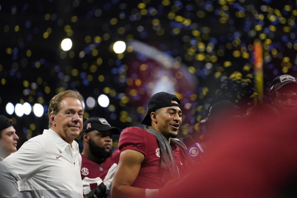 Alabama head coach Nick Saban and Alabama quarterback Bryce Young celebrate the teams win after the Southeastern Conference championship NCAA college football game between Georgia and Alabama, Saturday, Dec. 4, 2021, in Atlanta. Alabama won 41-24. (AP Photo/Brynn Anderson)