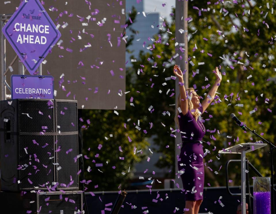 Confetti cannons go off as Kim Garrett, founder and chief visionary officer at Palomar celebrates on Tuesday, Sept. 13, 2022. Palomar was celebrating its "5 years of Changing Lives," in the lot where the new MAPS funded building will be built.