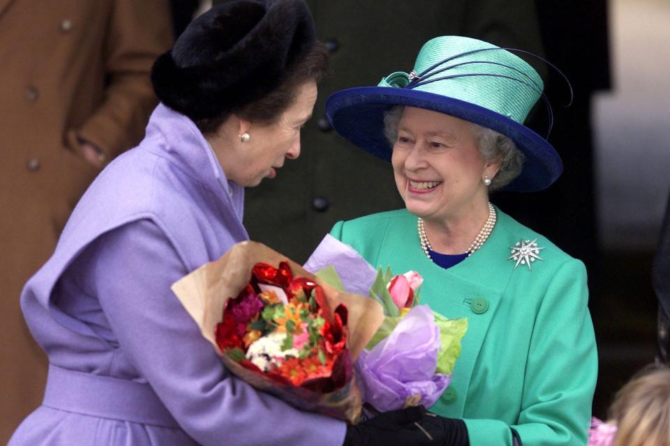 Queen Elizabeth II talks to Princess Anne after attending the Christmas Day church service at the Church at the Sandringham Estate in 2001.