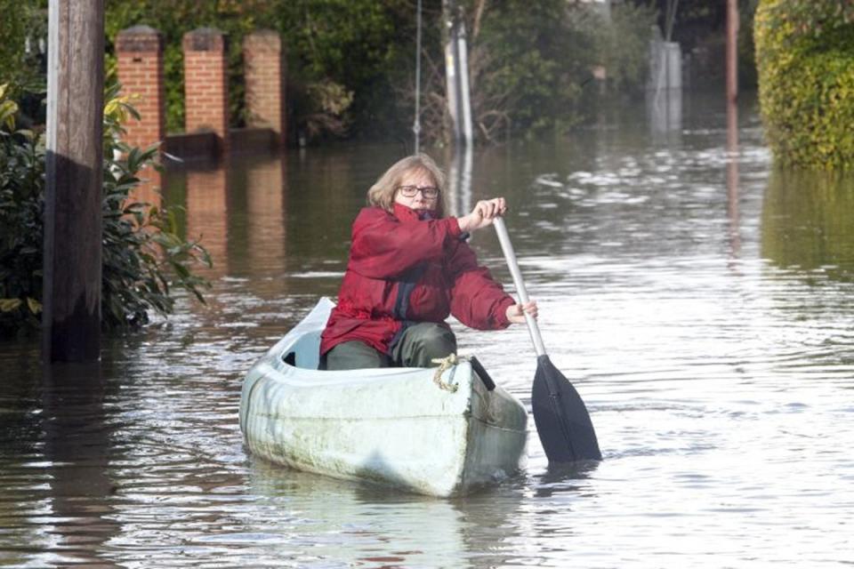 All at sea: a woman paddles in a canoe in Wraysbury